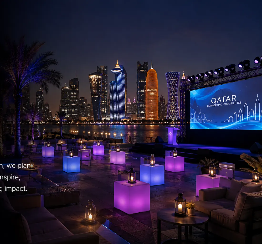 Event staging, lighting and lounge seating against the Doha skyline at night